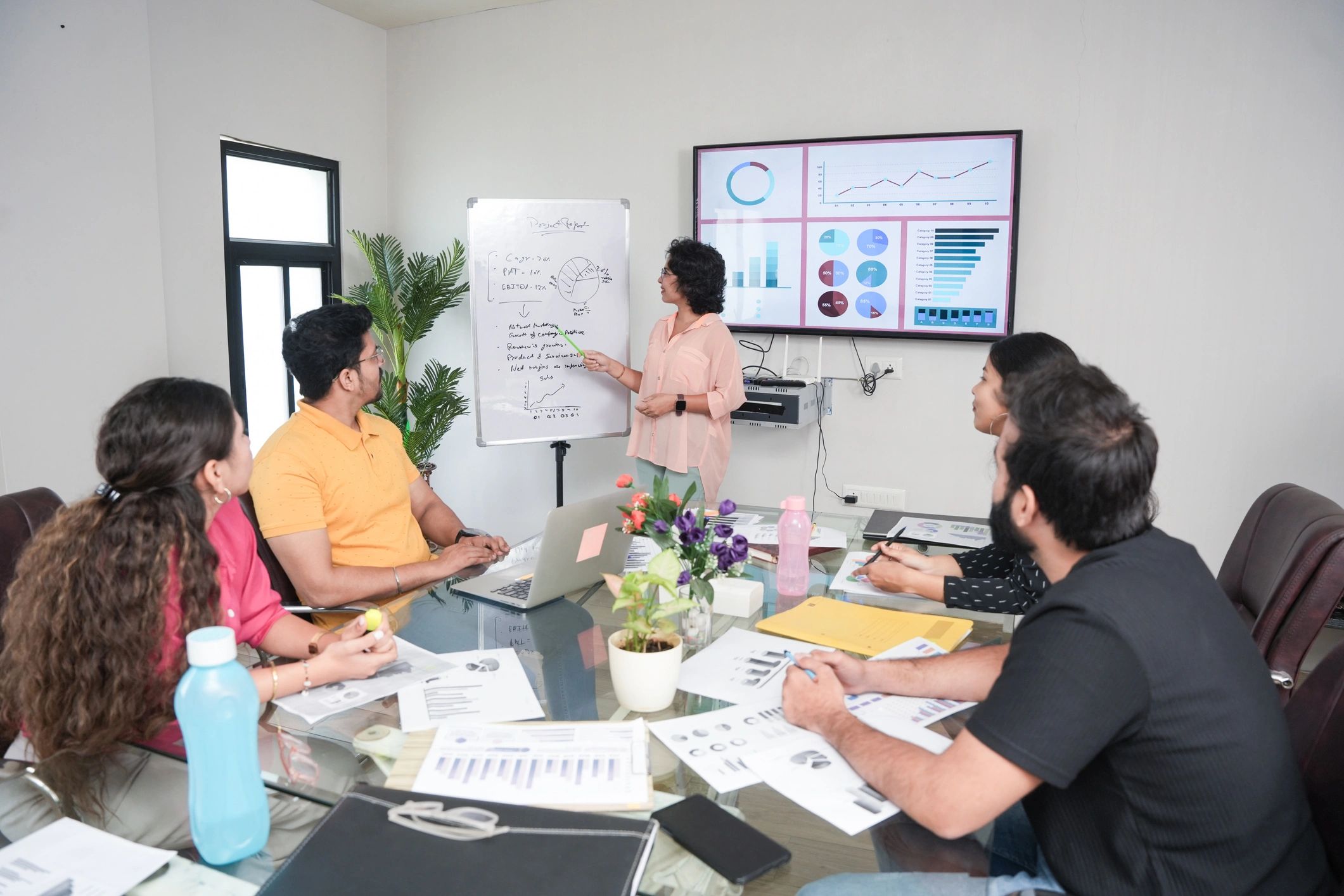 Trainer presenting ideas to a team during a design session